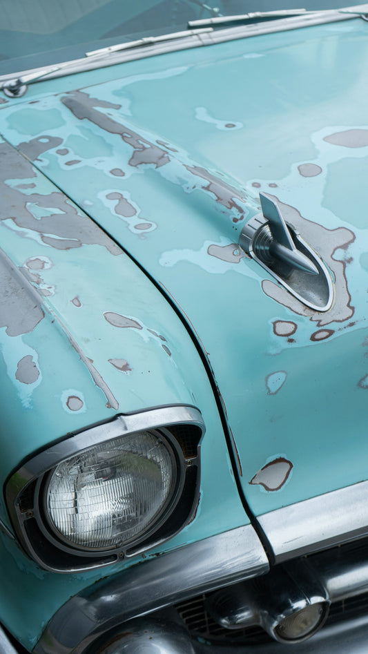 a close up of the front of an old car