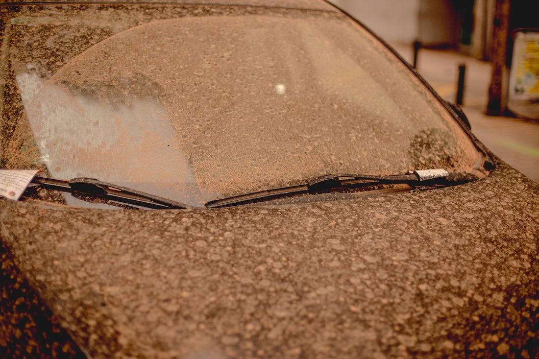 a close up of a car windshield with a tag on it